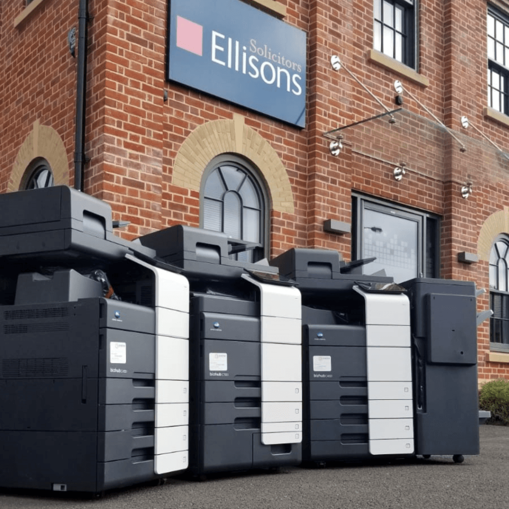 Three Konica Minolta devices outside of Ellison's Office