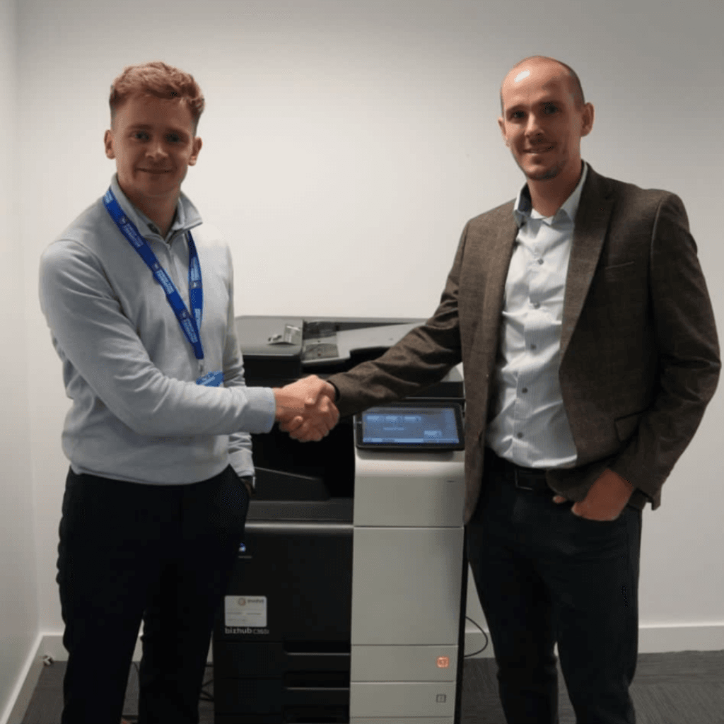 Ross Cracknell shaking hands with Dan Palfrey, Director of Ipswich Town Foundation